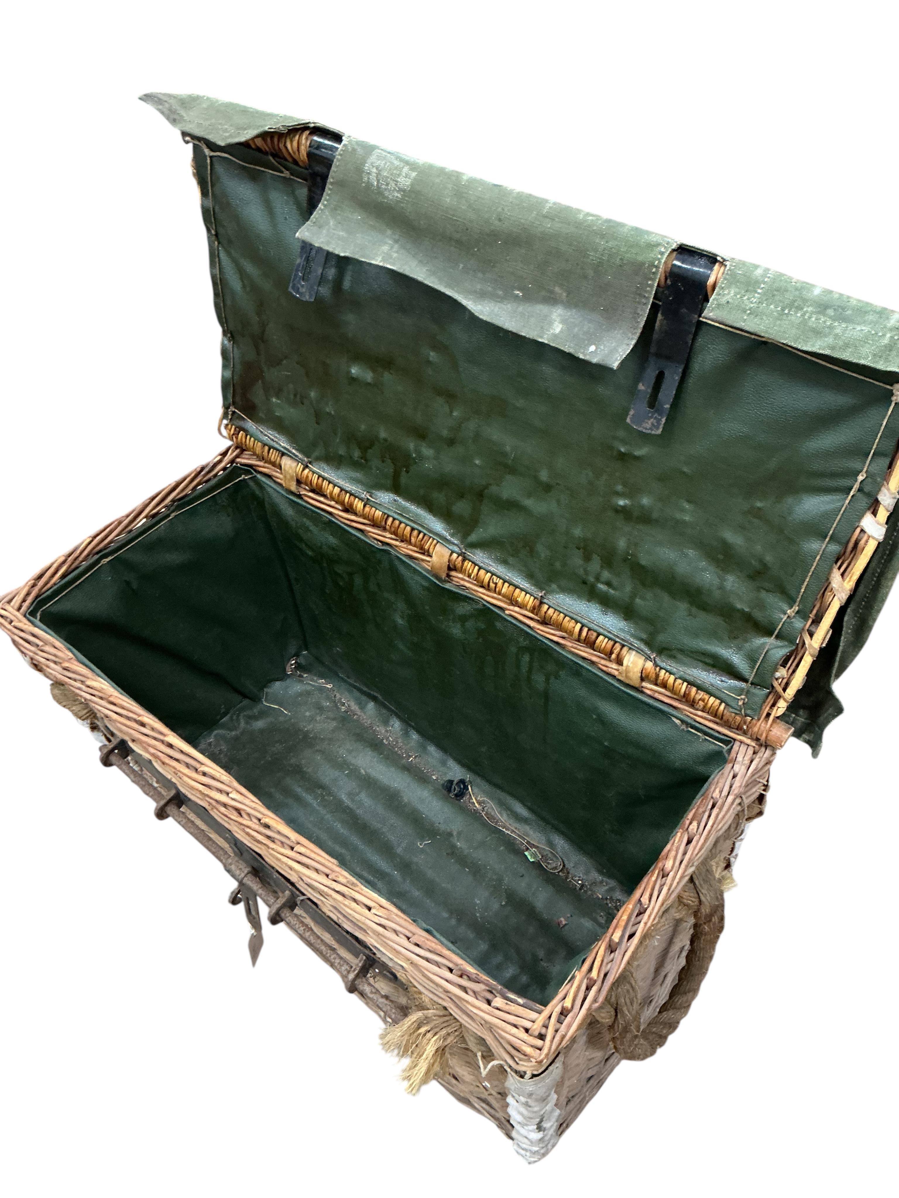 An early 20th century military part canvas covered wicker trunk, width 80cm, depth 42cm, height 50cm